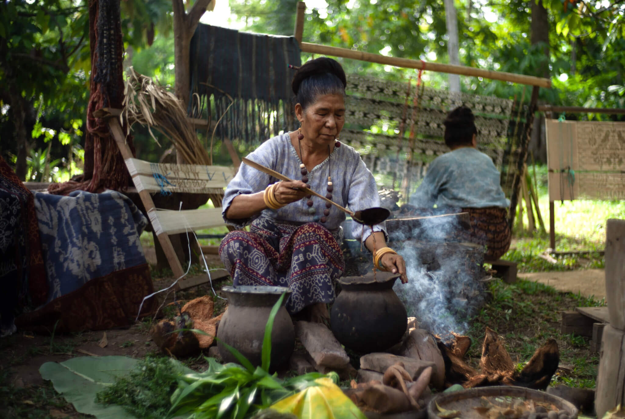 Elderly woman preparing food